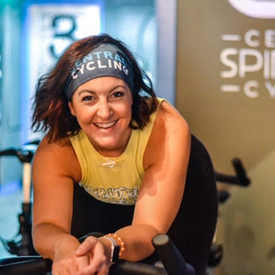Megan Lewis – Central Cycling spin studio athletes standing in front of Central Cycling downtown St Pete location